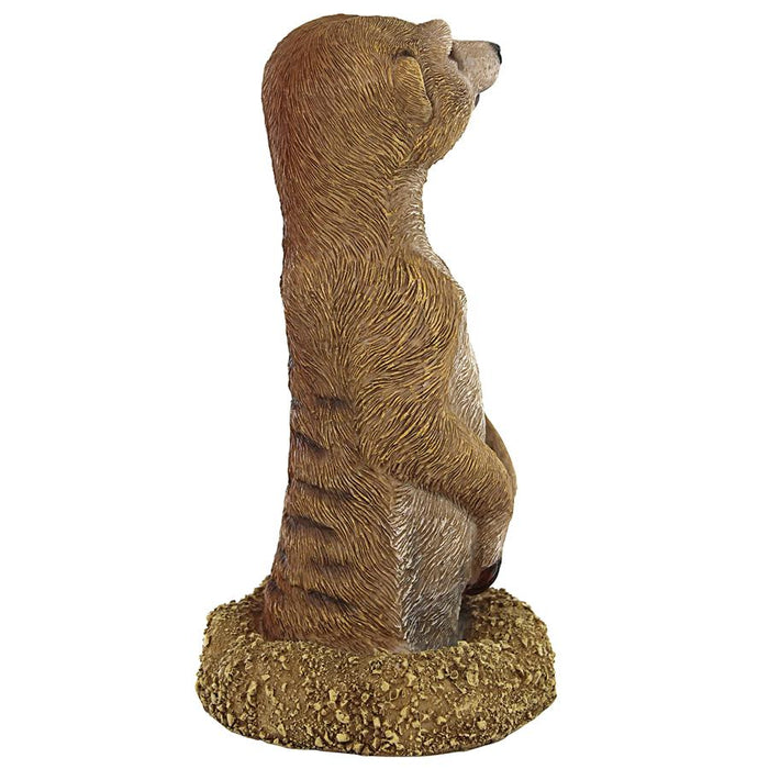 MEERKAT COMING OUT OF GROUND STATUE